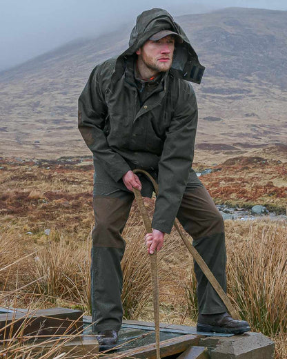 Green Coloured Hoggs of Fife Green King II Waterproof Jacket on mountain background 