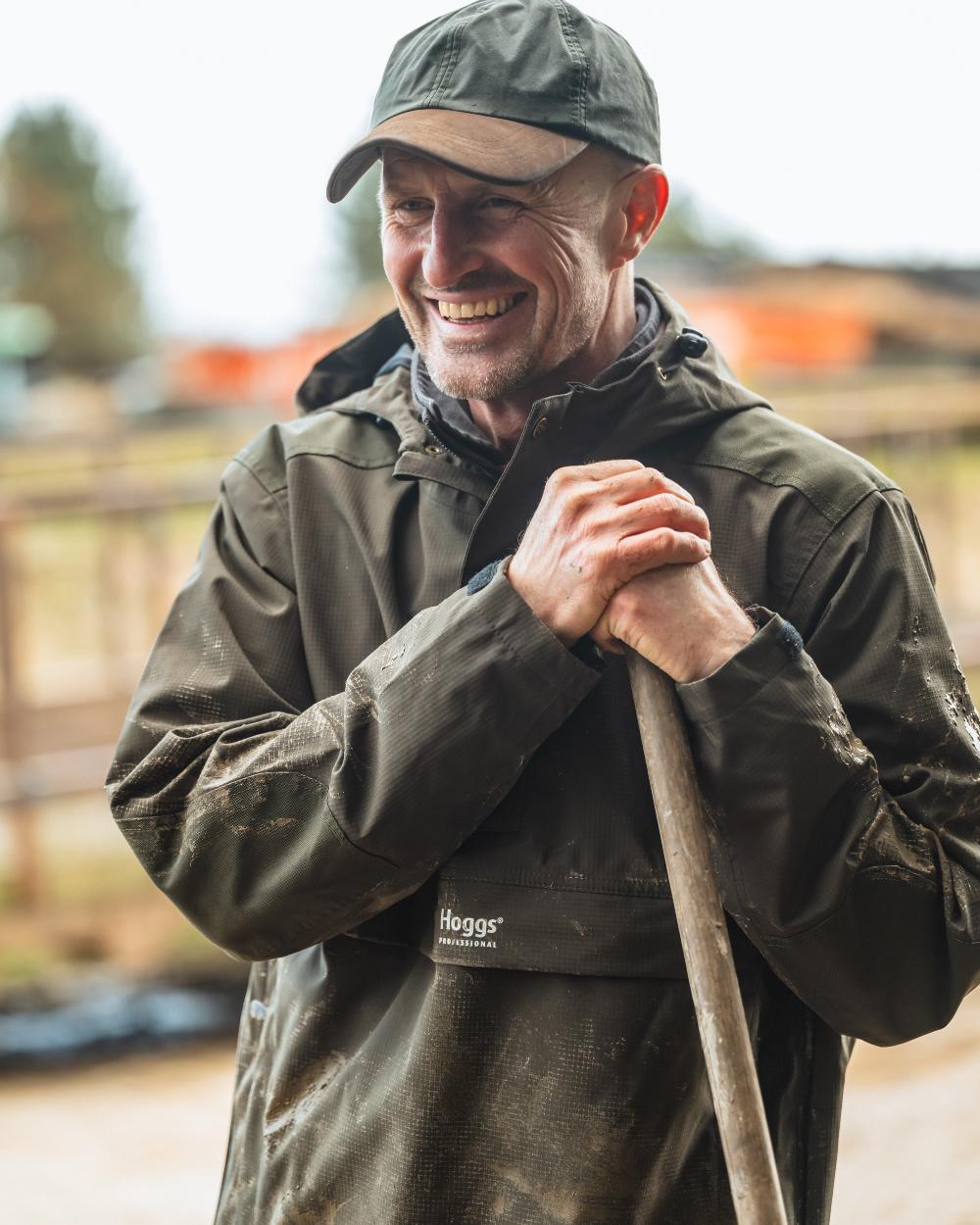 Green Coloured Hoggs of Fife Green King II Waterproof Smock on blurry background 