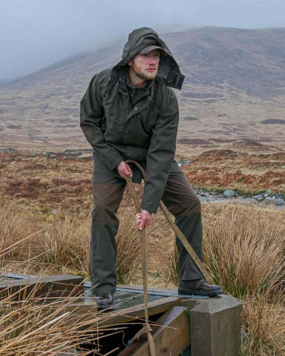 Green Coloured Hoggs of Fife Green King II Waterproof Trousers on barn background 