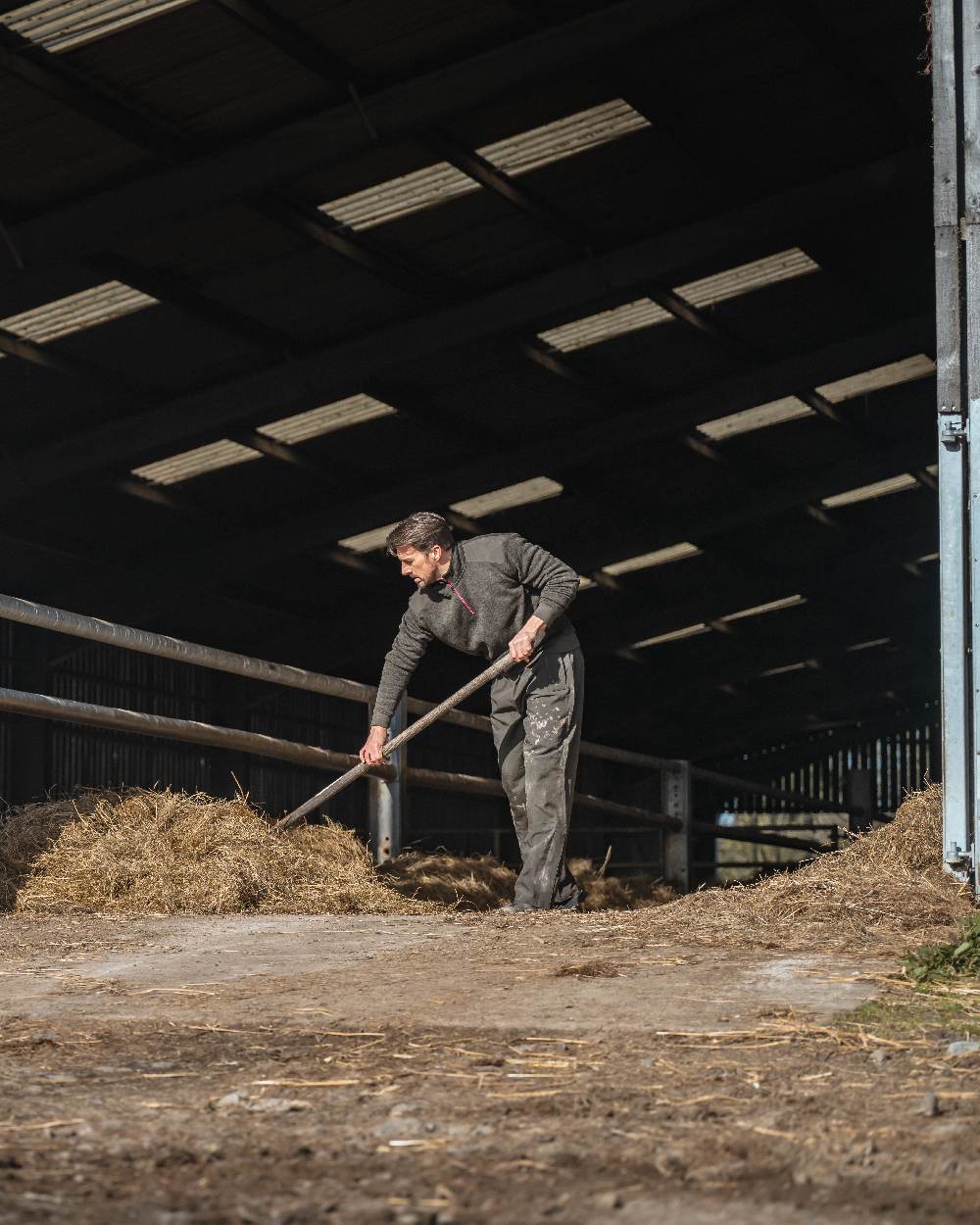 Green Coloured Hoggs of Fife Green King II Waterproof Trousers on barn background 