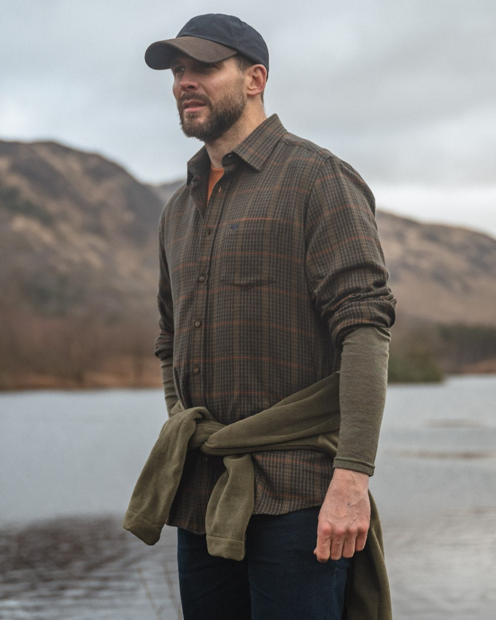Green coloured Hoggs of Fife Harris Cotton Wool Twill Check Shirt with mountain background 