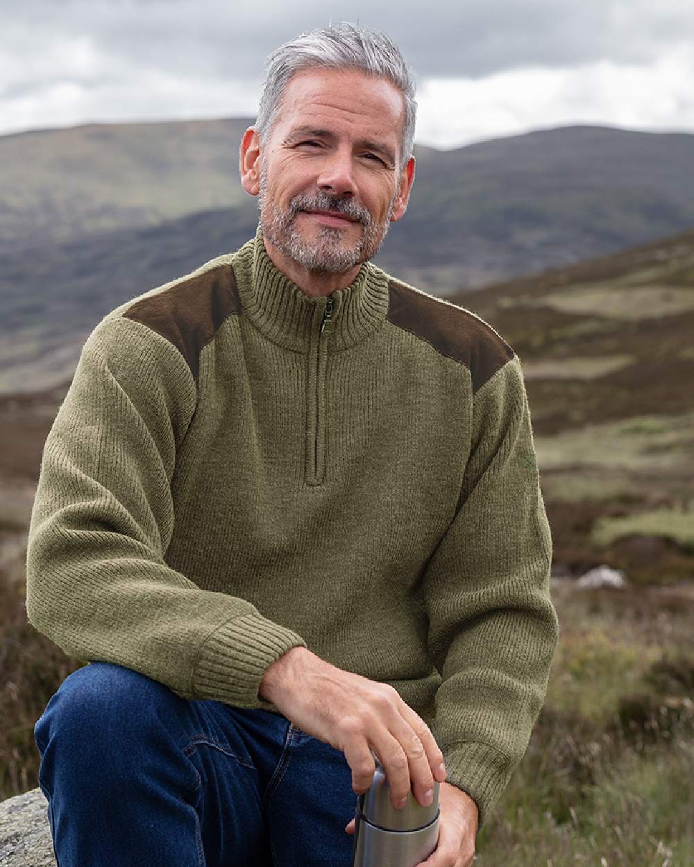 Meadow Green Coloured Hoggs of Fife Hebrides II Quarter Zip Windproof Pullover on mountain background 