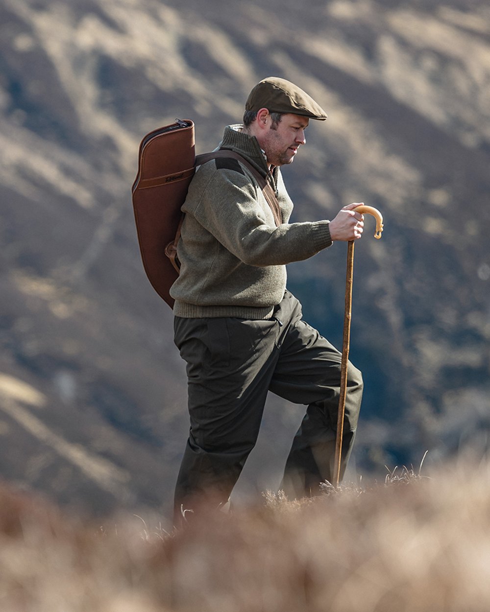 Meadow Green coloured Hoggs of Fife Hebrides II Quarter Zip Windproof Pullover on mountain background 