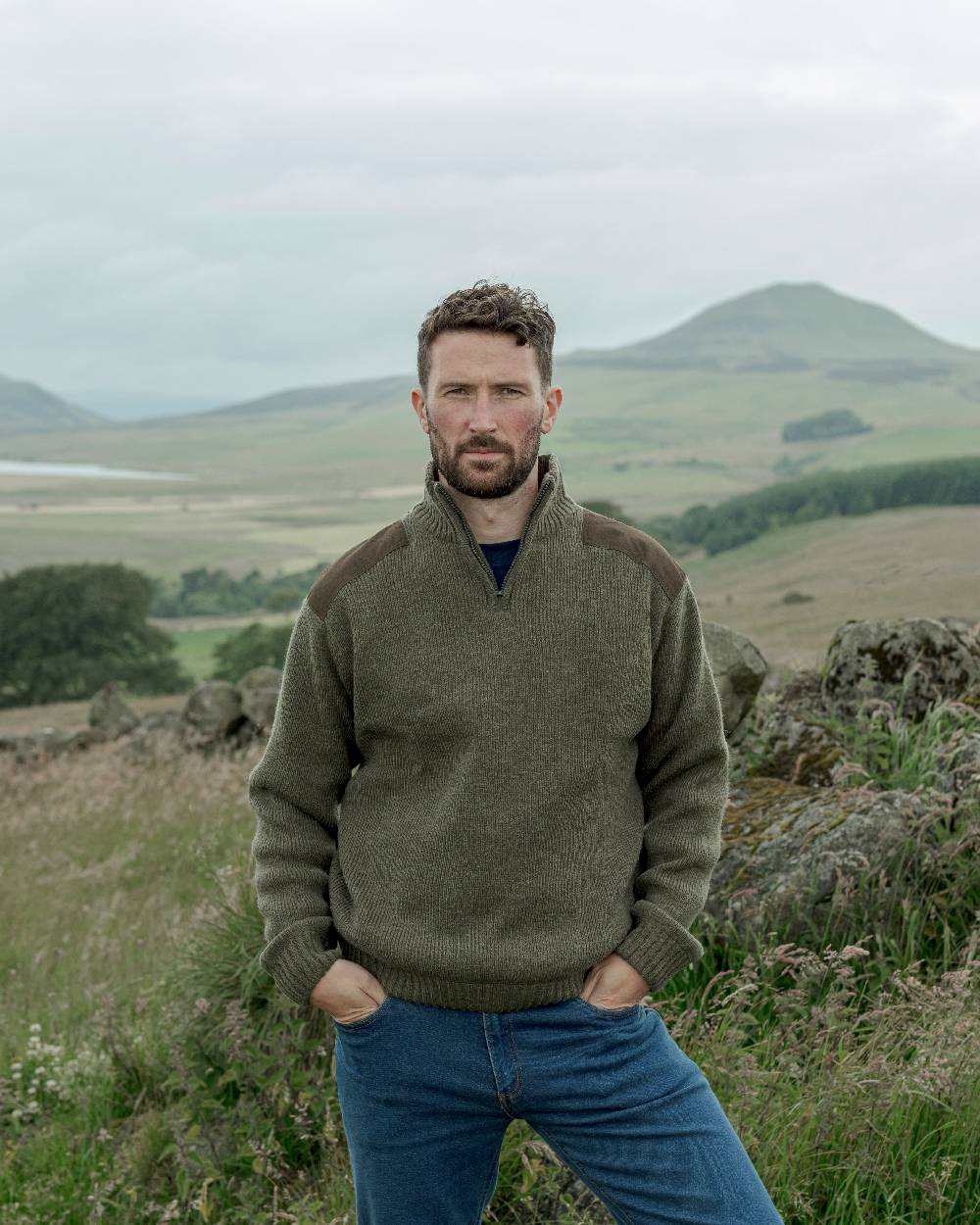 Loden Coloured Hoggs of Fife Hebrides Zip Neck Windproof Pullover on mountain background 