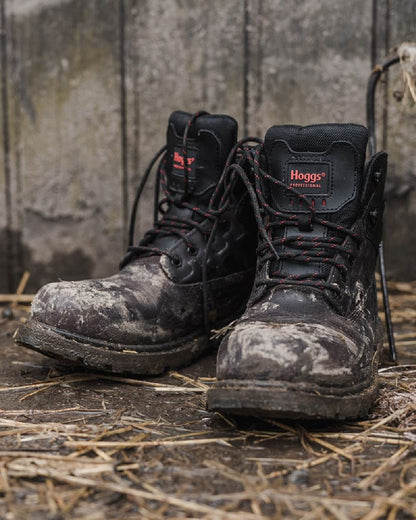 Black Coloured Hoggs of Fife Hercules Waterproof Safety Boots on land background 