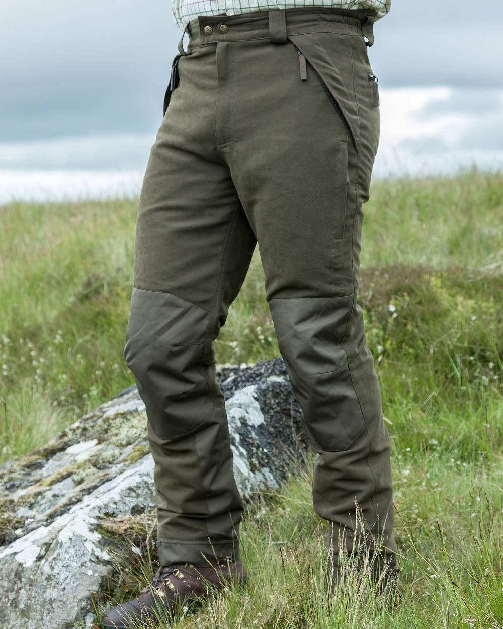 Olive Green Coloured Hoggs of Fife Kincraig Waterproof Field Trousers on land background 