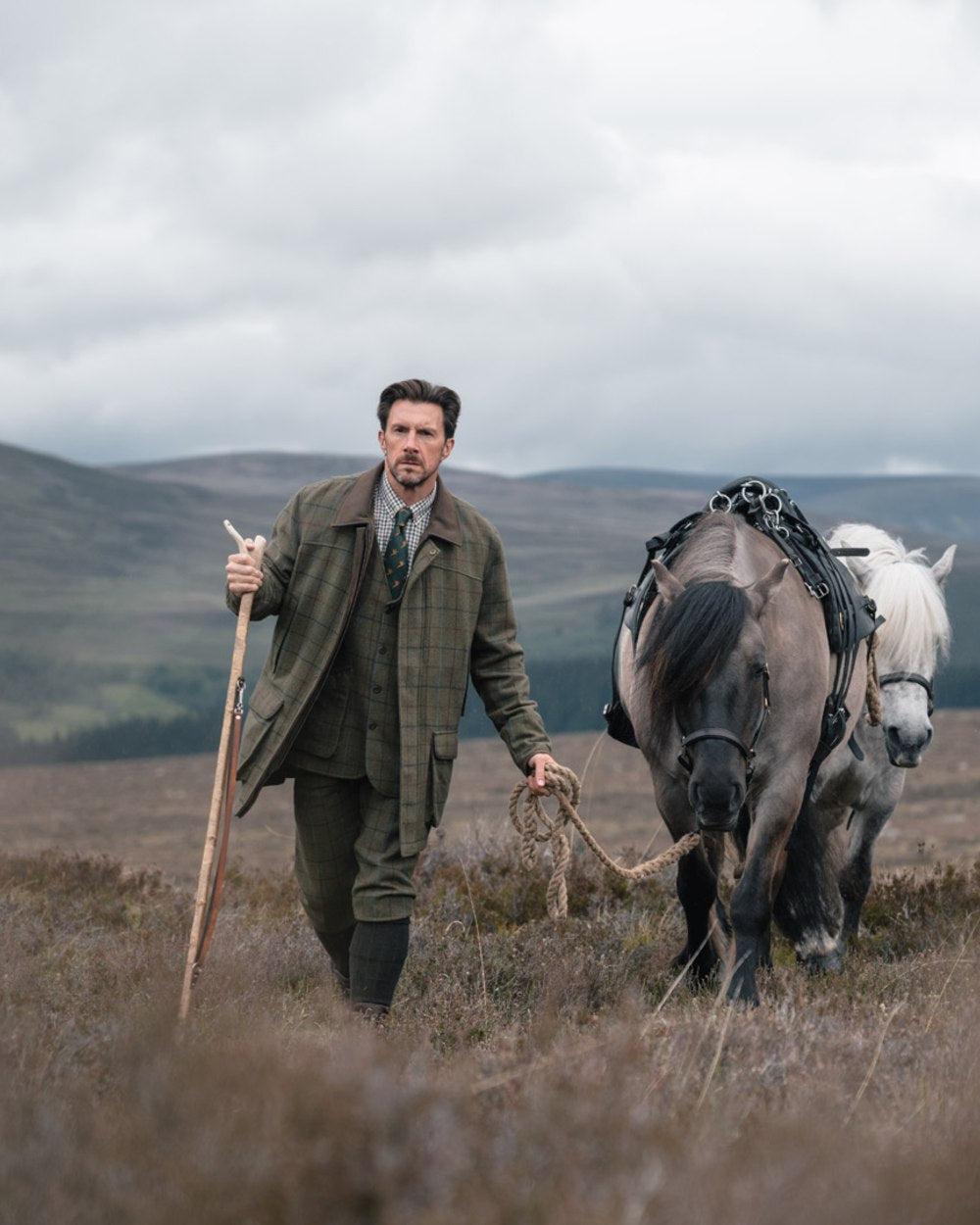 Green Blue Coloured Hoggs of Fife Mens Kingussie Tweed Dress Waistcoat on moorland background 