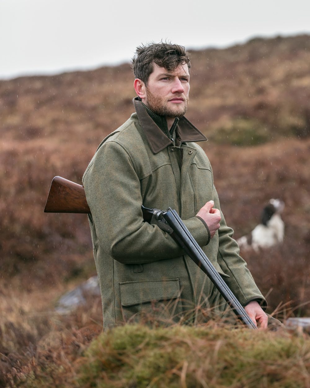 Autumn Bracken Coloured Hoggs of Fife Kinloch Technical Tweed Field Coat on mountain background 