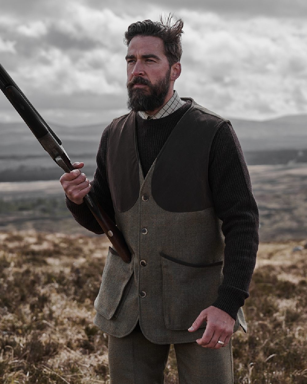 Autumn Bracken Coloured Hoggs of Fife Kinloch Technical Tweed Field Waistcoat on sky background 