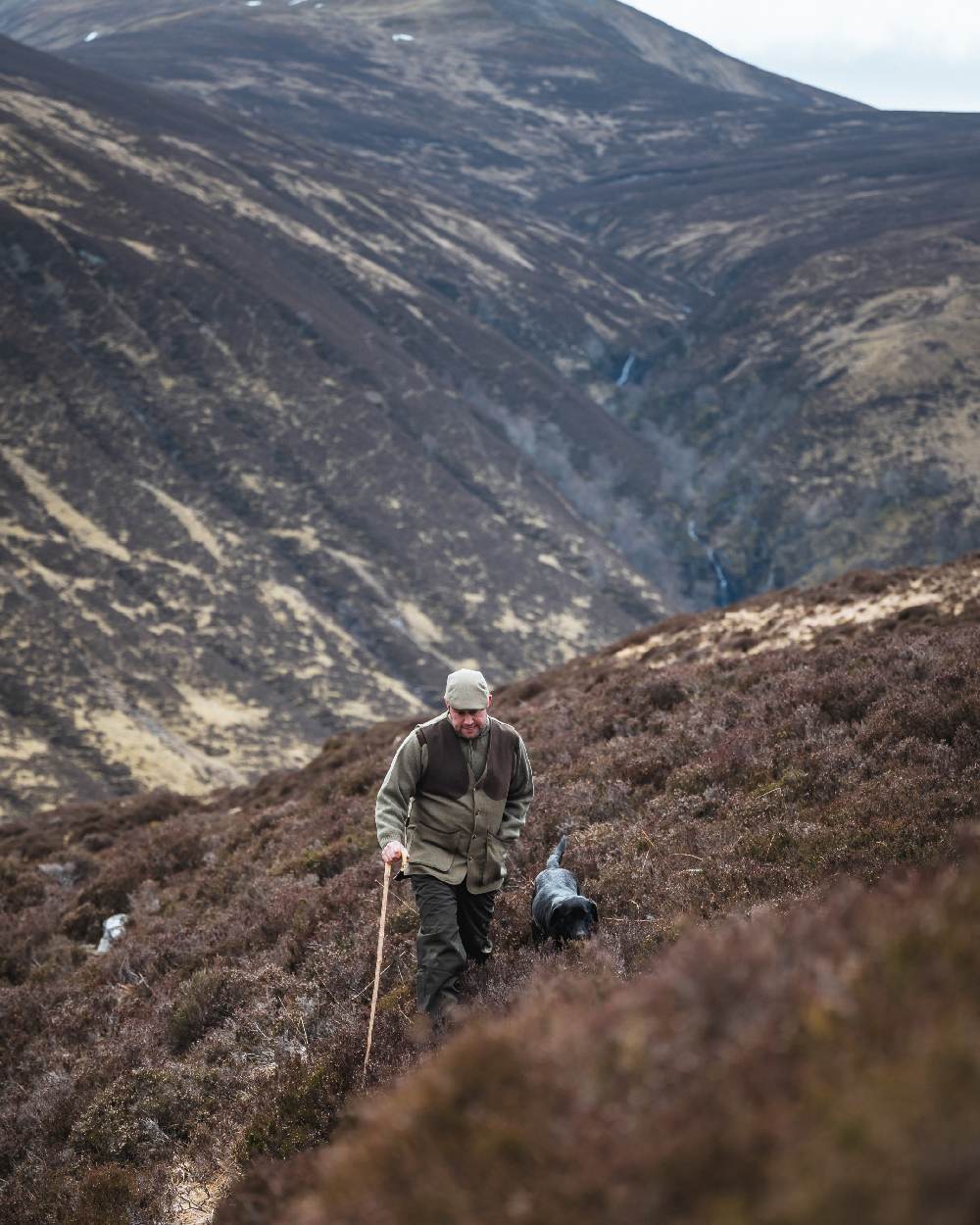 Autumn Bracken Coloured Hoggs of Fife Kinloch Technical Tweed Field Waistcoat on mountain background 