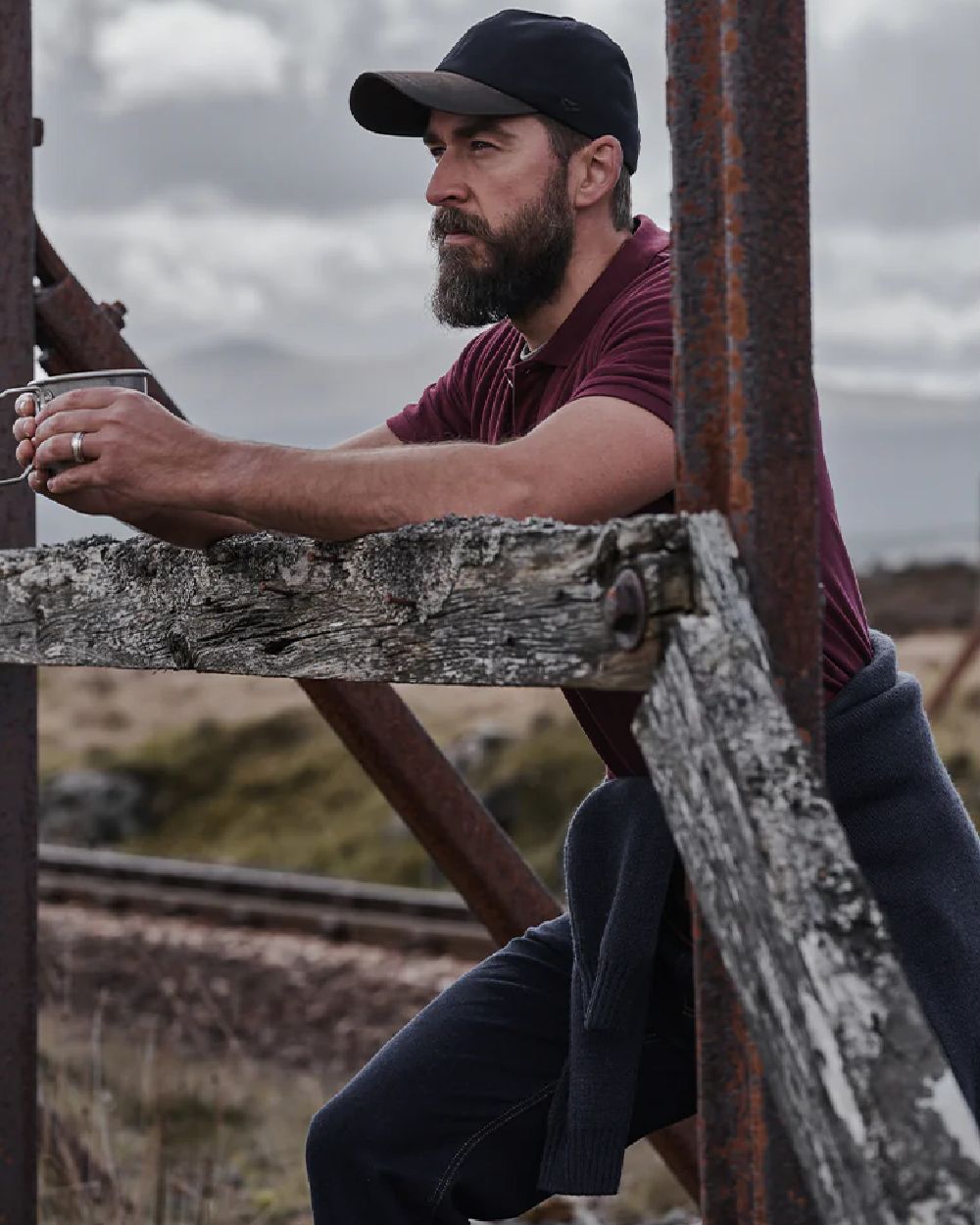 Bordeaux Coloured Hoggs of Fife Largs Pique Polo Shirt on mountain background 