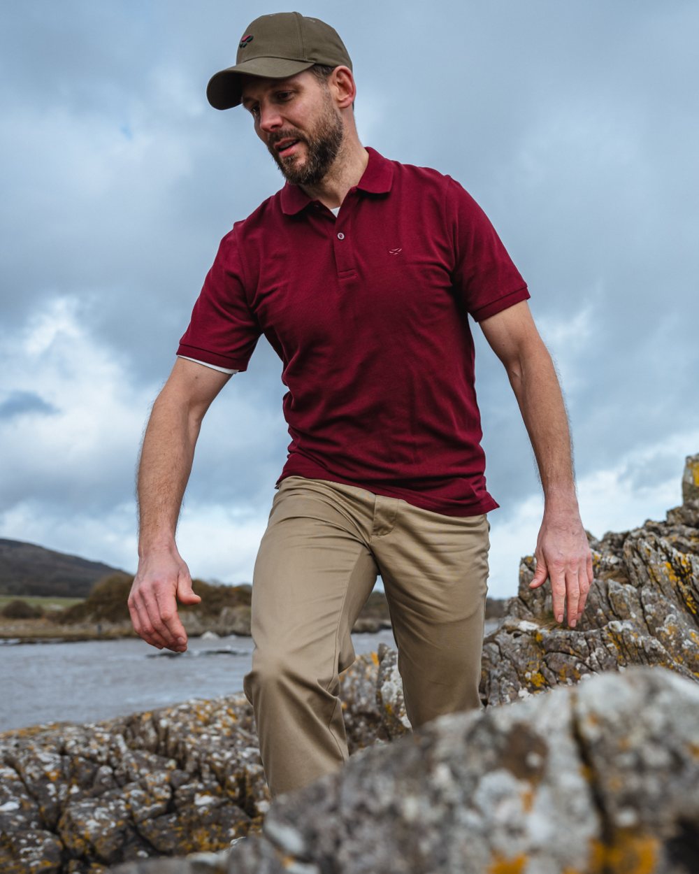 Bordeaux Coloured Hoggs of Fife Largs Pique Polo Shirt on sky background 