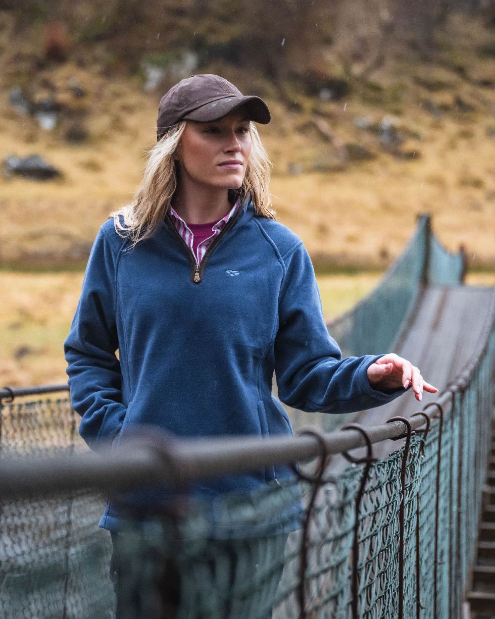 Brown Coloured Hoggs of Fife Leather Peak Waxed Baseball Cap on  countryside background 