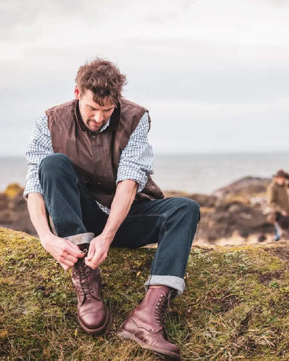 Chocolate Coloured Hoggs of Fife Lomond II Leather Waistcoat on sky background 