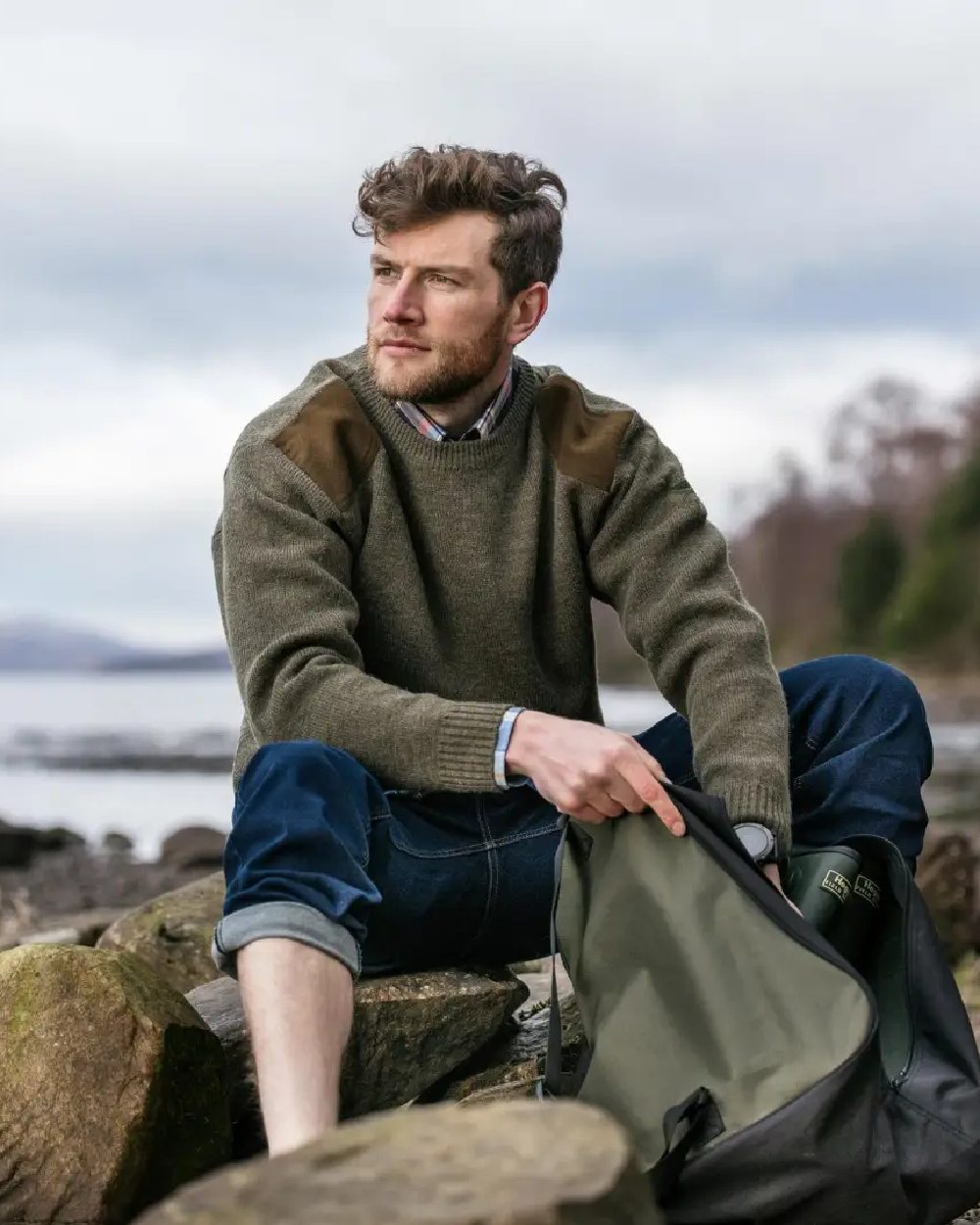 Marled Green Coloured Hoggs of Fife Melrose Hunting Pullover on coastal background 