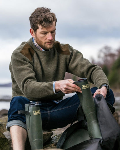 Marled Green Coloured Hoggs of Fife Melrose Hunting Pullover on coastal background 