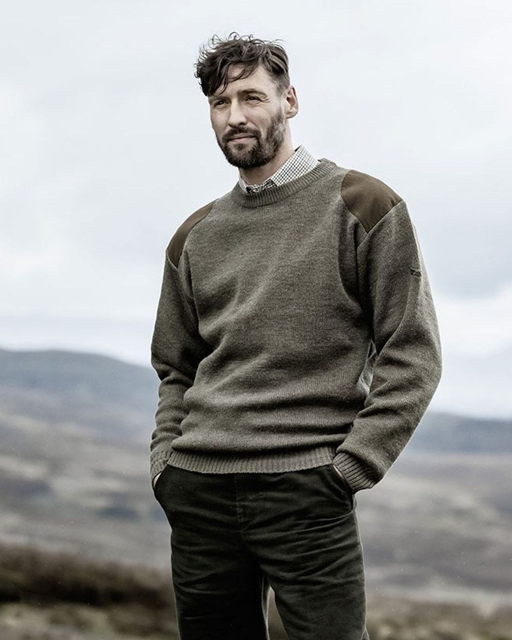 Marled Green Coloured Hoggs of Fife Melrose Hunting Pullover on mountain background 