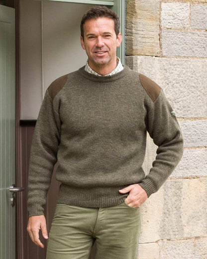 Marled Green Coloured Hoggs of Fife Melrose Hunting Pullover on door background 