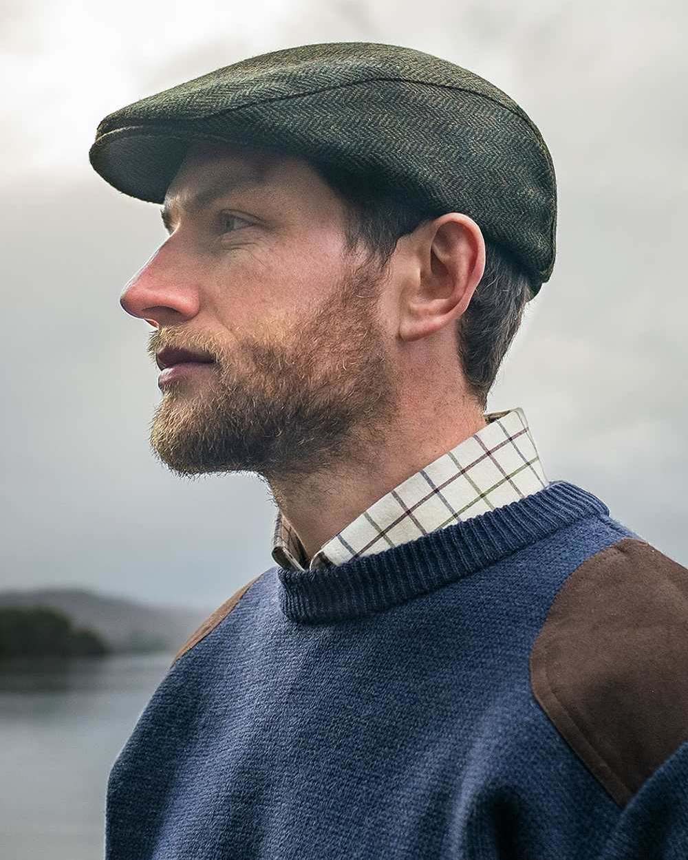 Marled Navy Coloured Hoggs of Fife Melrose Hunting Pullover on sea background 