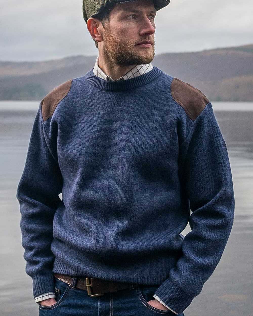 Marled Navy Coloured Hoggs of Fife Melrose Hunting Pullover on sea background 