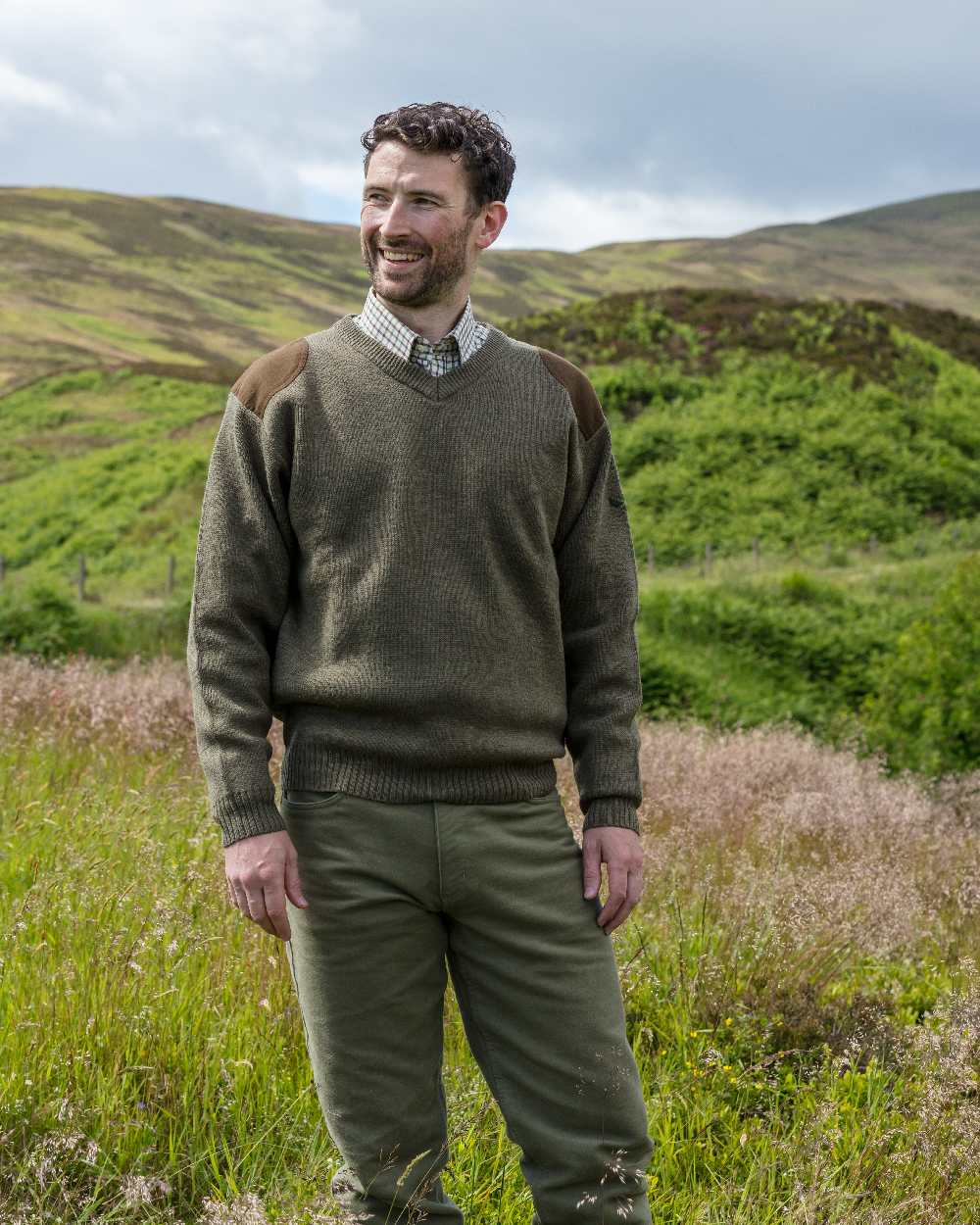 Loden Coloured Hoggs of Fife Melrose V-Neck Hunting Pullover on mountain background 