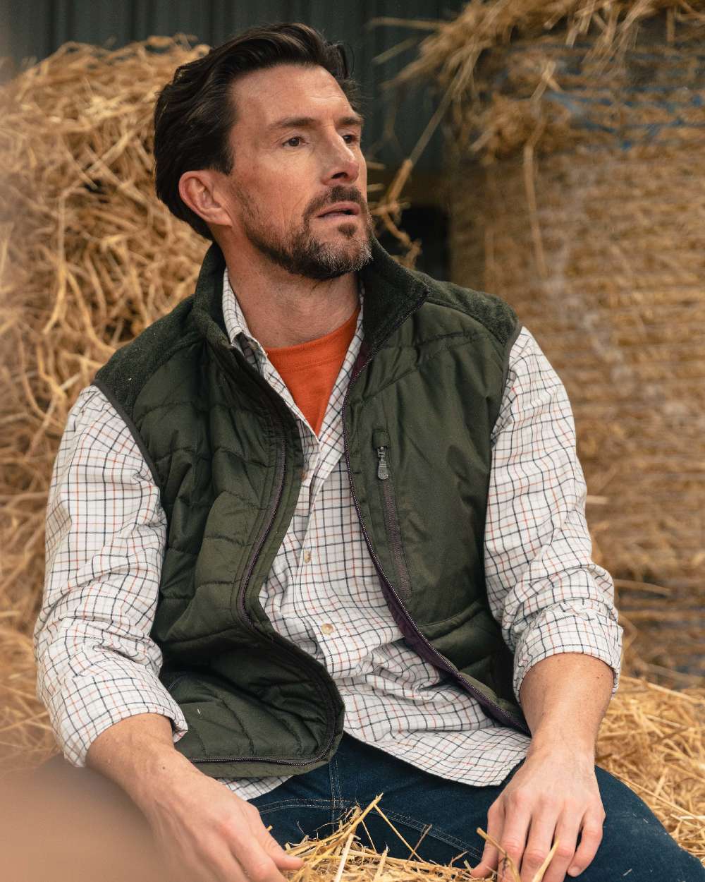 Dark Forest Marl Coloured Hoggs of Fife Mens Melville Hybrid Gilet on outdoor background 