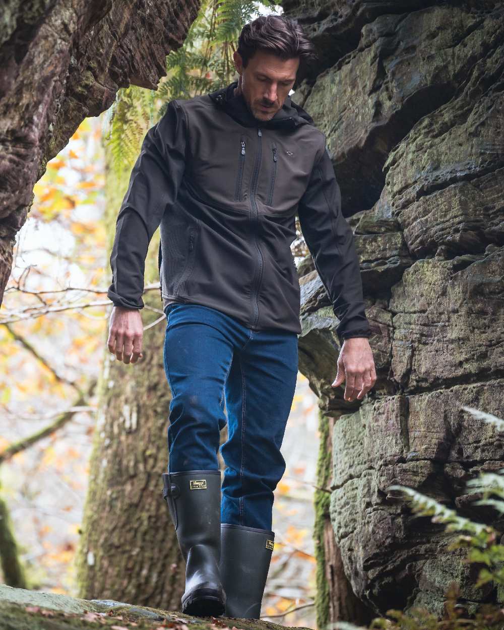 Green Coloured Hoggs of Fife Mens Ardross 4 Way Active Jacket on forest background 