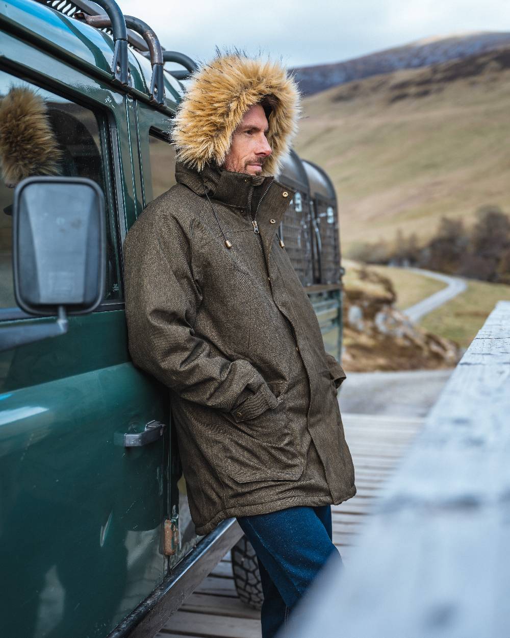 Forest Green coloured Hoggs of Fife Mens Argyll II Jacket on mountain background 