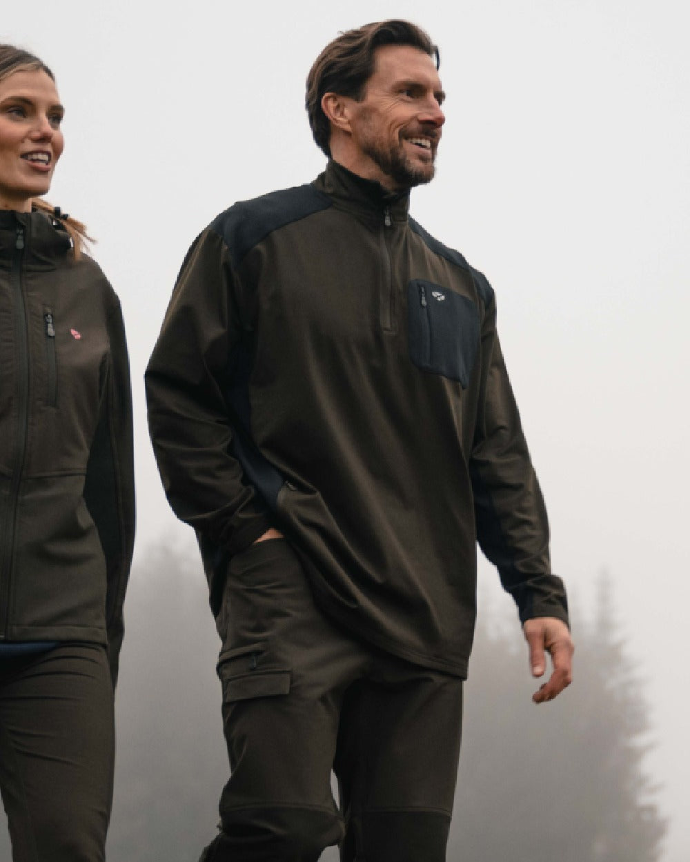 Green Black coloured Hoggs of Fife Mens Barra Active Quarter Zip Top on outdoor background 