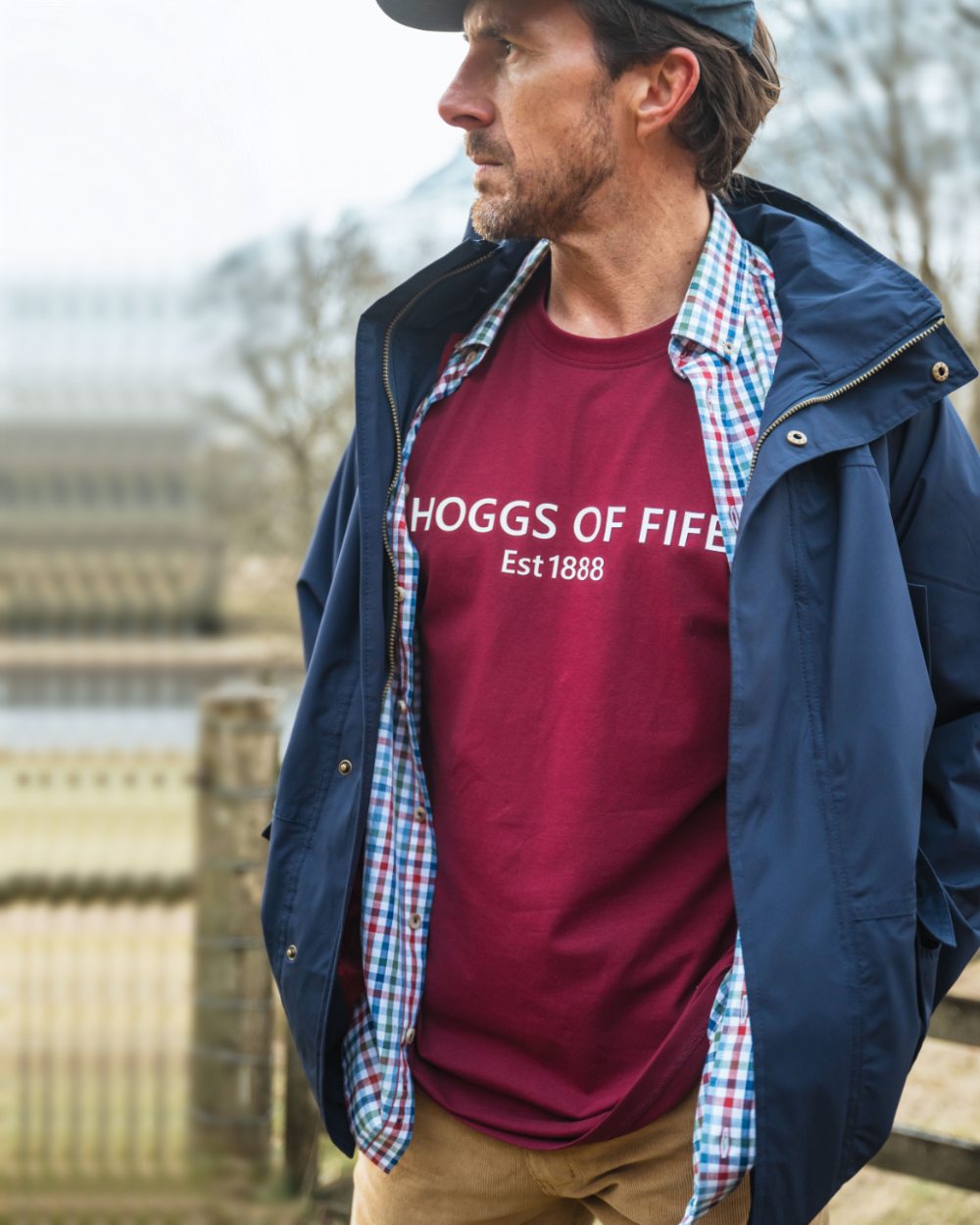 Burgundy Coloured Hoggs of Fife Mens Canonbie Printed T-Shirt on blurry background 