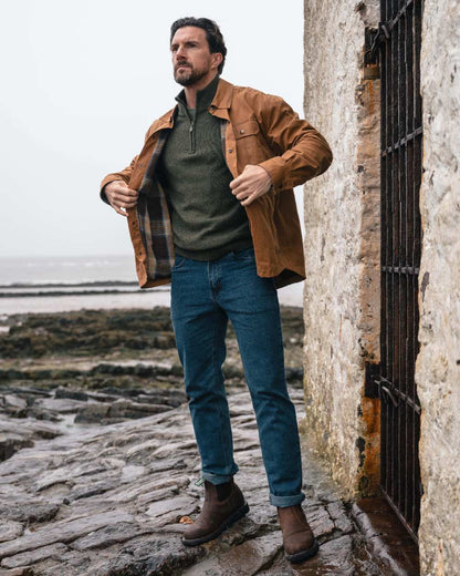 Caramel coloured Hoggs of Fife Mens Huntly Waxed Canvas Utility Overshirt on coastal background 