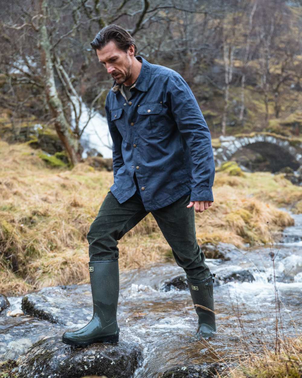 Midnight Navy Coloured Hoggs of Fife Mens Huntly Waxed Canvas Utility Overshirt on mountain background 