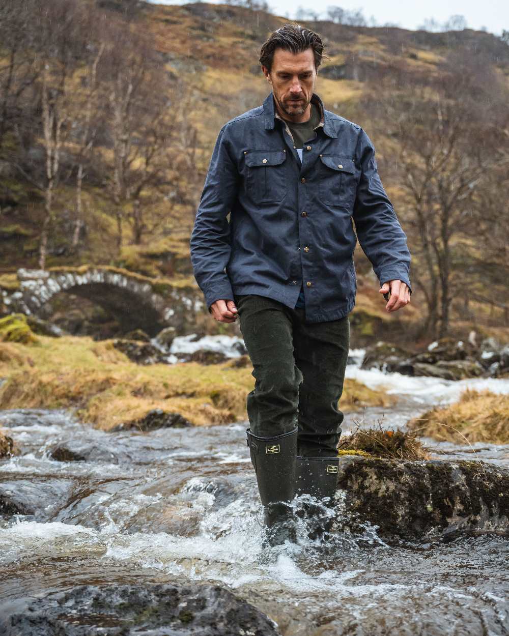 Midnight Navy Coloured Hoggs of Fife Mens Huntly Waxed Canvas Utility Overshirt on mountain background 