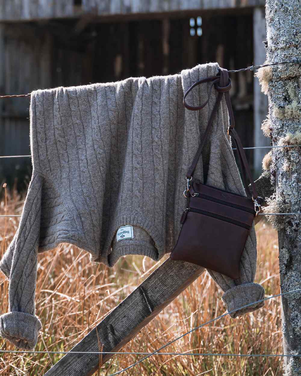 Oatmeal Marl Coloured Hoggs of Fife Mens Jedburgh II Cable Pullover on outdoor background 