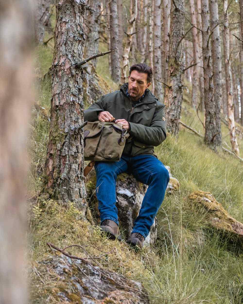 Forest Green Coloured Hoggs of Fife Mens Kelso Waterproof Wax Jacket on outdoor background 