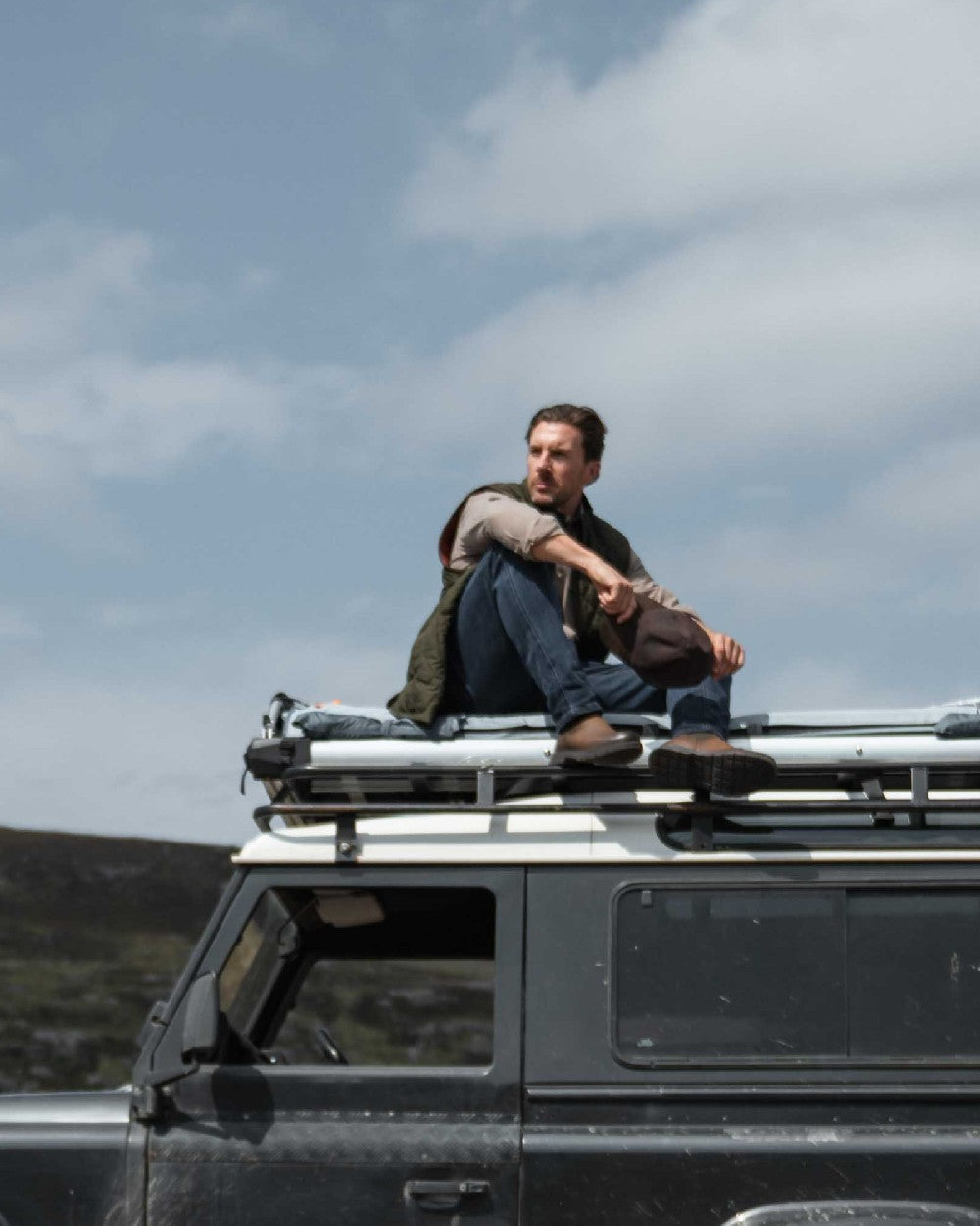 Forest Green Coloured Hoggs of Fife Mens Lindores Quilted Gilet on sky background 