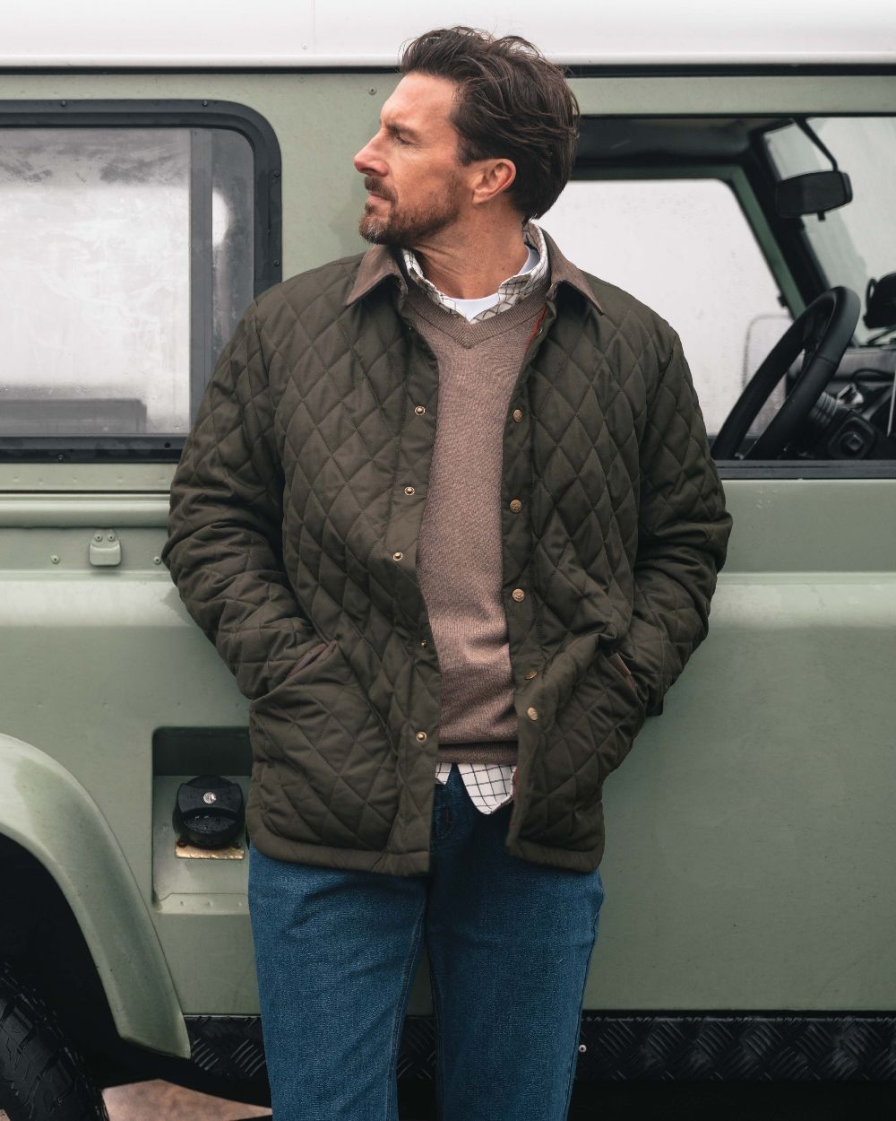 Forest Green Coloured Hoggs of Fife Mens Lochore Quilted Jacket on outdoor background 