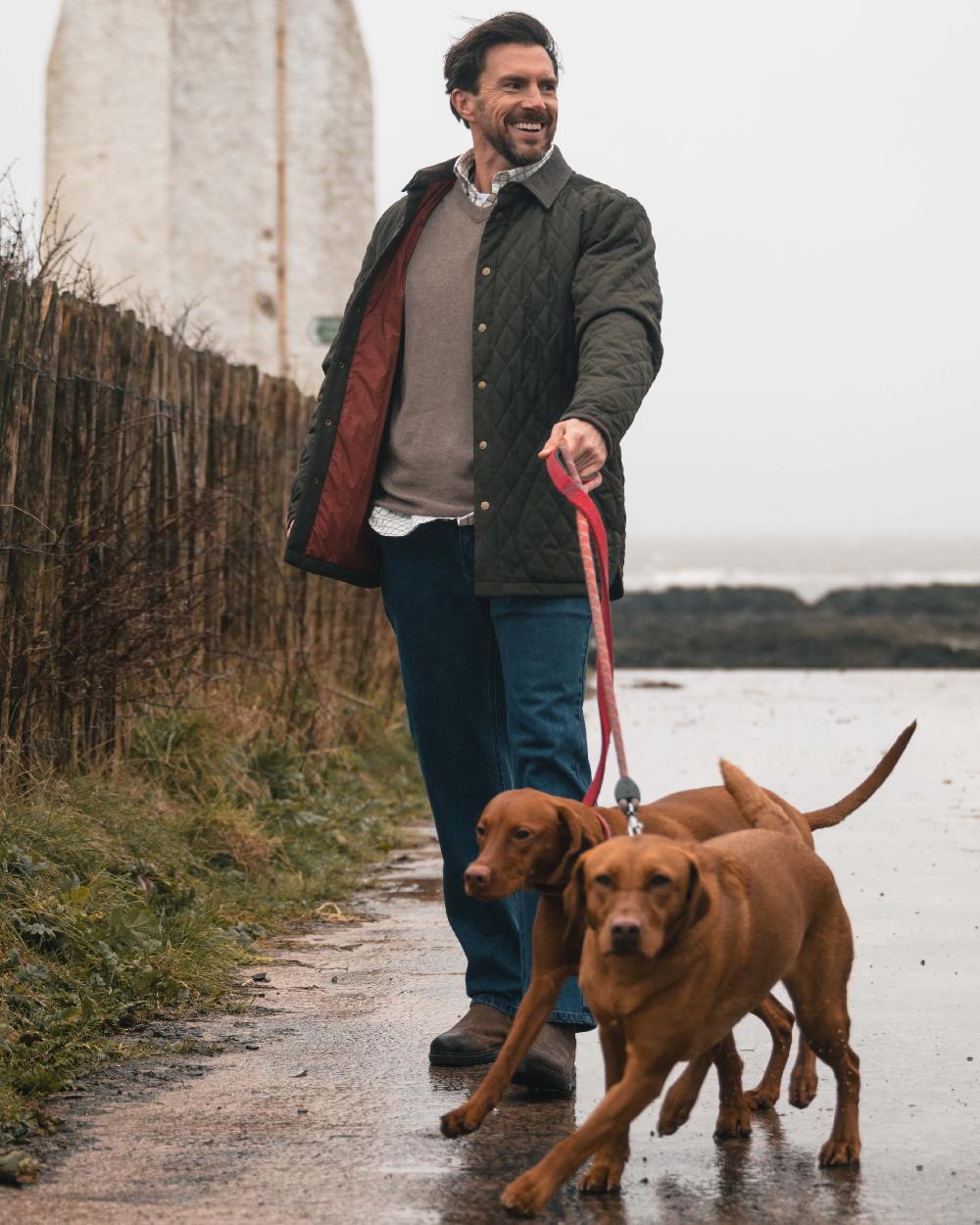 Forest Green Coloured Hoggs of Fife Mens Lochore Quilted Jacket on outdoor background 