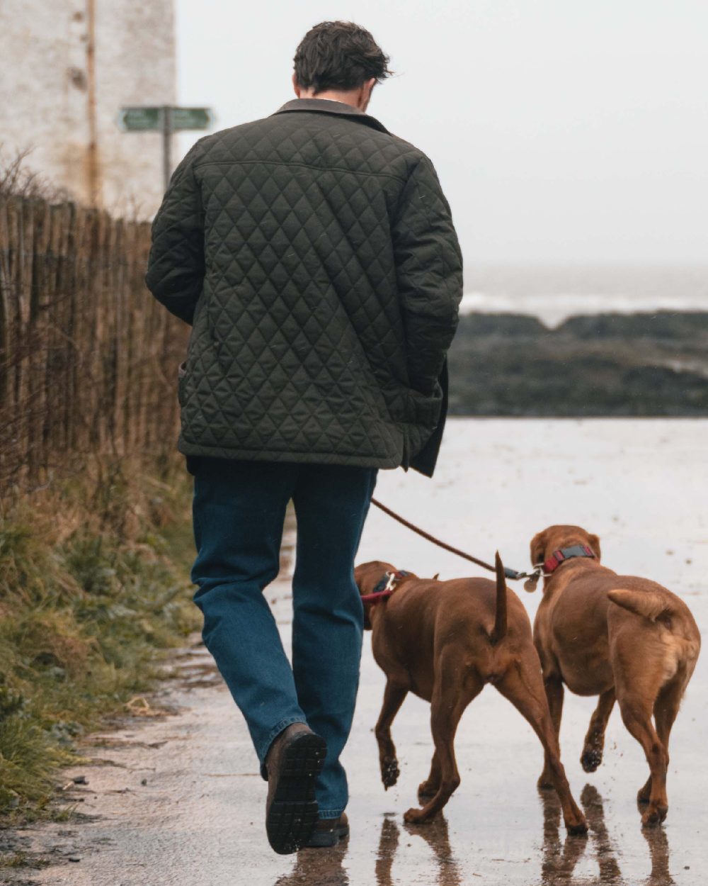 Forest Green Coloured Hoggs of Fife Mens Lochore Quilted Jacket on outdoor background 