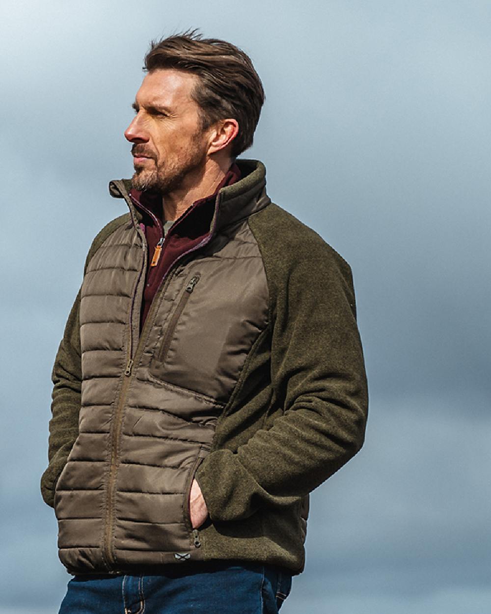 Juniper Marl Coloured Hoggs of Fife Mens Melville Hybrid Jacket on sky background 