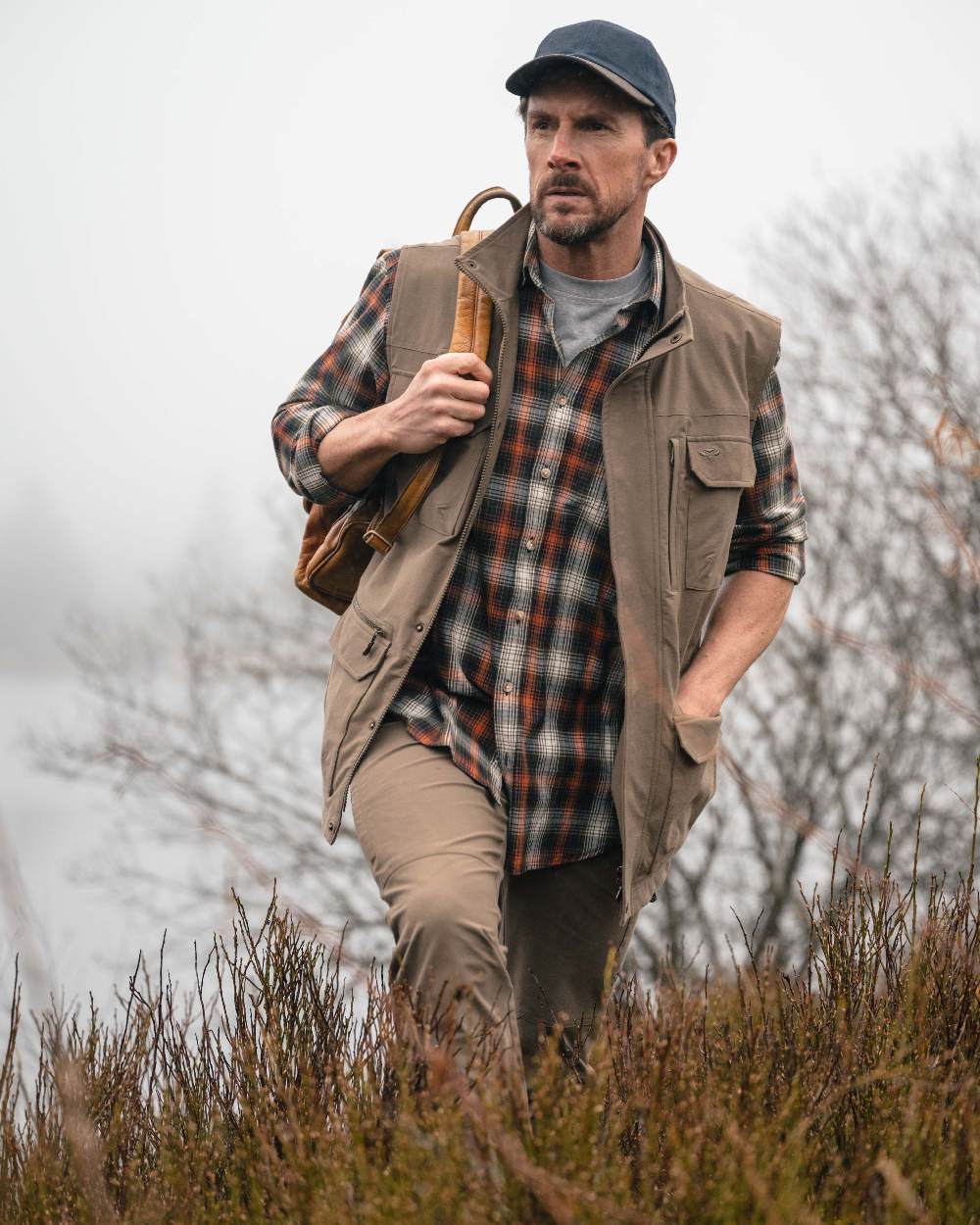 Khaki Coloured Hoggs of Fife Mens Rothesay Utility Gilet on lake background 