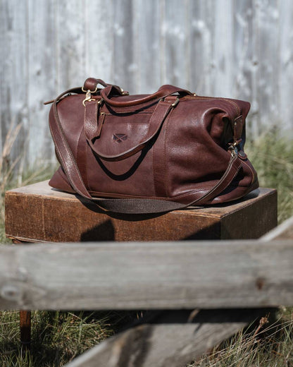 Conker Coloured Hoggs of Fife Monarch Leather Carryon Holdall on outdoor background 