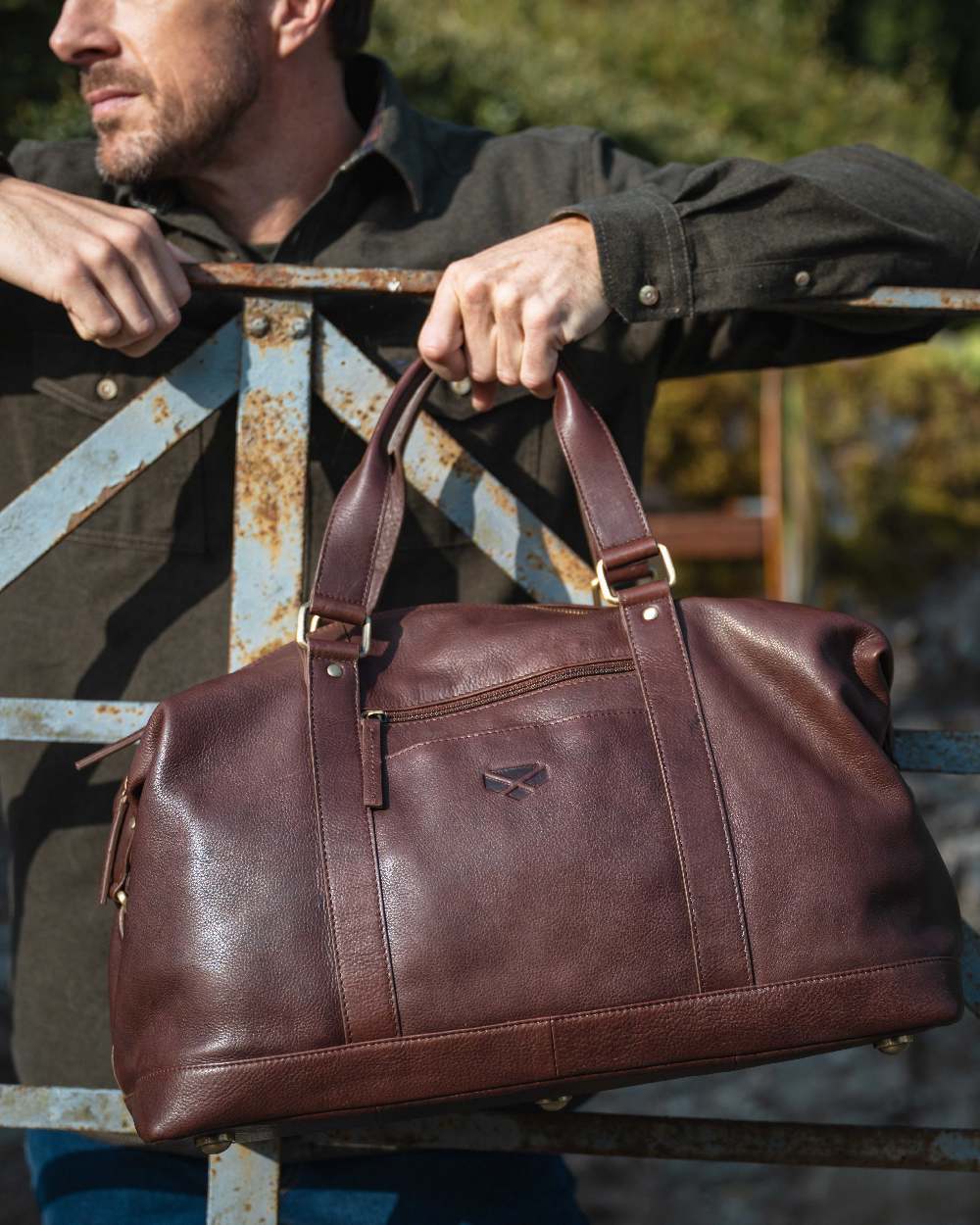 Conker Coloured Hoggs of Fife Monarch Leather Carryon Holdall on outdoor background 