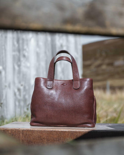Conker Coloured Hoggs of Fife Monarch Leather Handbag on outdoor background 