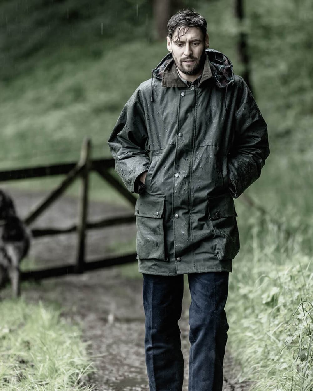 Olive Coloured Hoggs of Fife Padded Waxed Jacket on forest background 