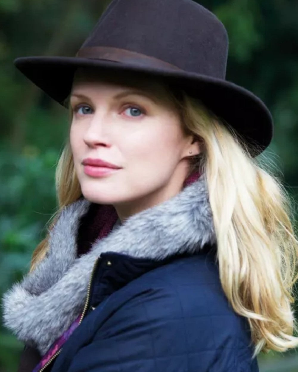 Navy Coloured Hoggs of Fife Perth Crushable Felt Hat on blurry background 