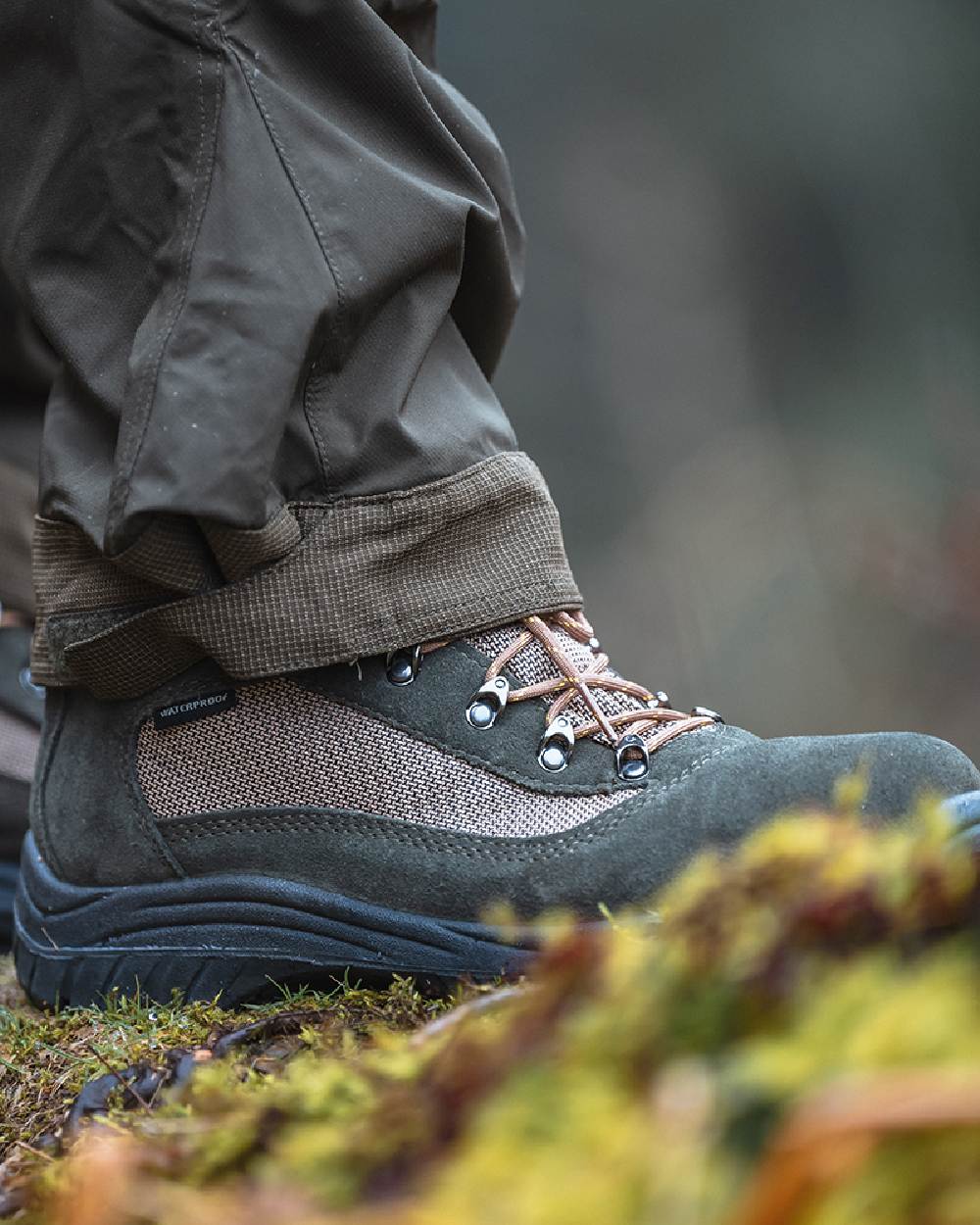 Fern Green Coloured Hoggs of Fife Rambler Waterproof Hiking Boots on blurry background 