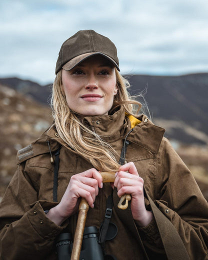 Field Green Coloured Hoggs of Fife Rannoch Ladies Hunting Jacket on mountain background 