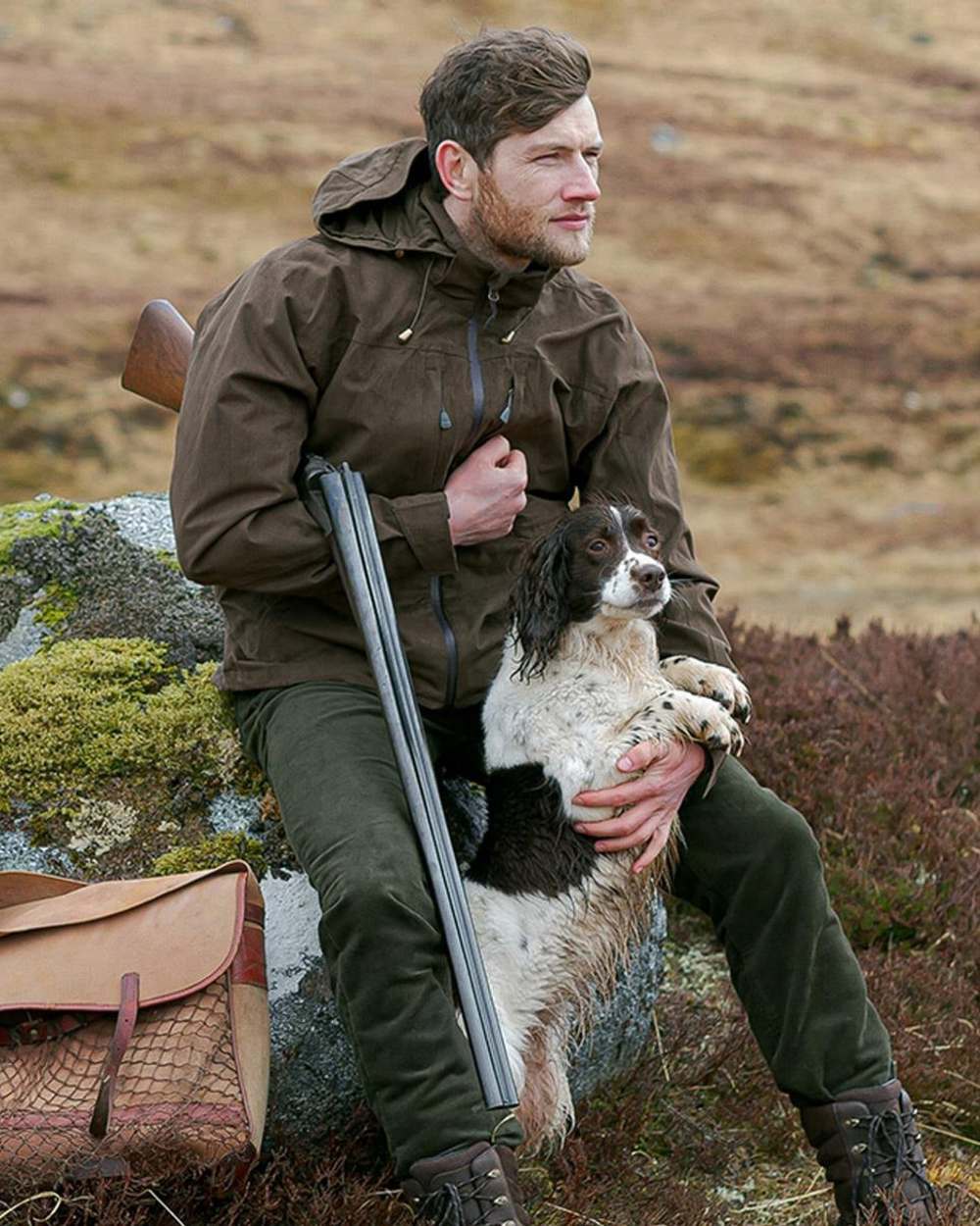 Brown Coloured Hoggs of Fife Rannoch Waterproof Shooting Jacket on countryside background 