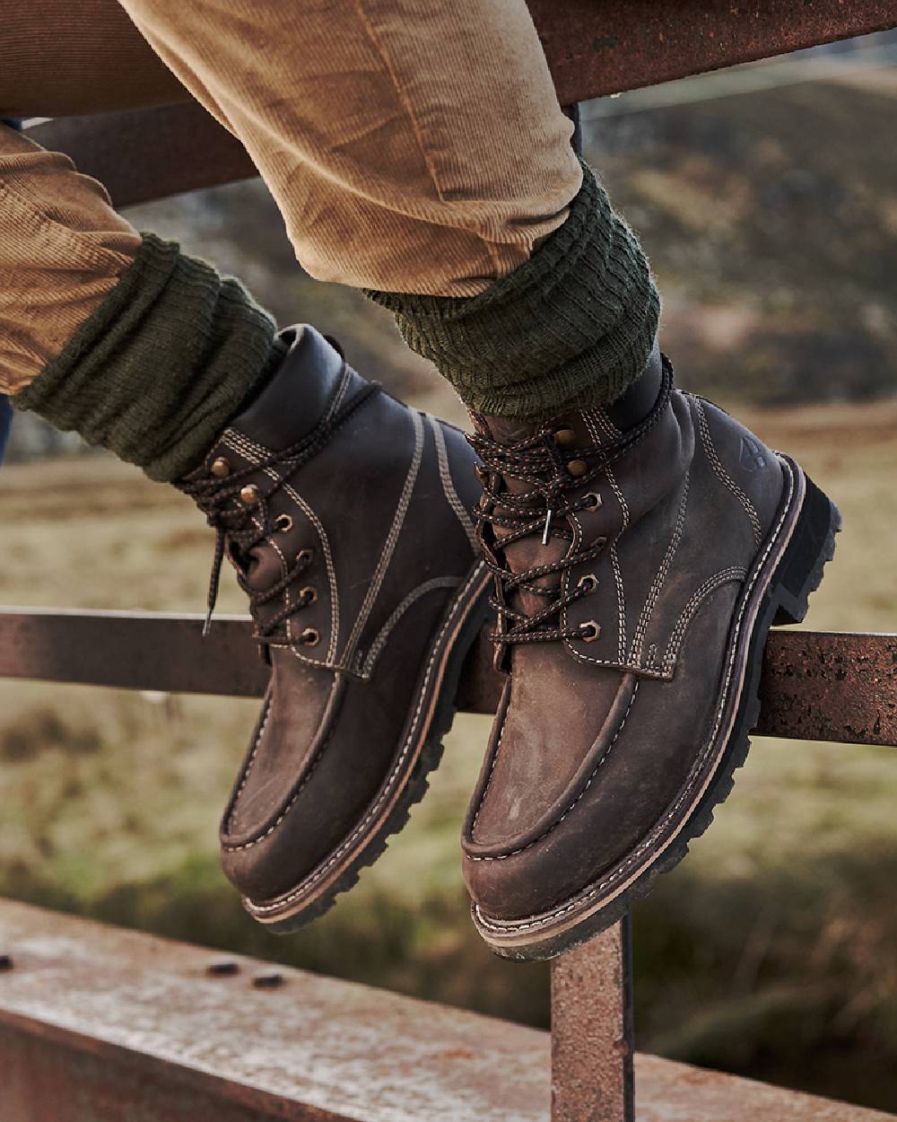 Oak Brown Coloured Hoggs of Fife Selkirk Moc Work Boots on countryside background 